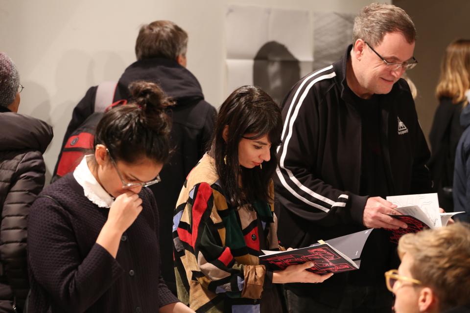 People looking at books